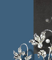 A pierced gold tiara of a frieze of graduated cyclamen leaves and flowers tied with ribbons.