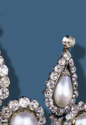 The tiara boasts 13 saltwater pearls - six button-shaped ones ringed with diamonds and seven pear-shaped pearls dangling from tear-drop diamond surmounts