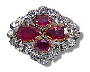 This brooch originally formed part of the ruby and diamond Parure created by Mnire in 1816 to designs by his son-in-law, Evrard Bapst, who succeeded him as Jewellers to the French Crown. The Parure was made using stones from the Empress Marie-Louise's ruby and diamond Parure. Which had been commissioned by Napoleon from Franois-Regnault Nitot and delivered to the Crown Treasury on 16th January 1811. When the original Parure was dismantled in 1816 the principal rubies and other ornaments that could be integrated into the design without alteration were kept intact.

This magnificent Parure was created for Marie-Thrse, Duchesse d'Angoulme  1778-1851  daughter and sole surviving child to Louis XVI and Marie-Antoinette. In 1799 she married her first cousin, Louis-Antoine, Duc d'Angoulme. His father, as the second brother of Louis XVI, became Charles X of France, successor to Louis XVIII. On her father-in law's accession to the throne the Duchesse d'Angoulme became the Dauphine de France.

By 1825 the parure had been enriched and embellished for the Duchesse d'Angoulme to wear at the Coronation of Charles X. During his reign further enrichments were carried out and by the end of his reign in 1830 the Parure comprised one diadem, one coronet, one large and one small necklace, one large belt, one pair of bracelets, one pair of earrings, one pendant, two jewelled accessories, one rosette shaped fastener and fourteen corsage studs. The Parure was worn successively by the royal princesses and latterly by Empress Eugnie who wore it for her Wedding Banquet in 1853.

This brooch was included in the catalogue of The French Crown Jewels sold on the 12th-23rd of May 1887 in the Pavillon de Flora.

The tiara and the pair of bracelets which formed part of this Parure were sold by Sotheby's London on the 30th November 1961 as part of the 'Casket of Magnificent Jewels' sold by order of the Executors of Cornelia, Countess of Craven. The bracelets are now on display in the 'Gallerie d' Apollon' in the Louvre, having been donated by M.Claude Menier. The necklace was sold at auction in Geneva in 1982 and again in 1993, while the pendant was sold by Sotheby's London on the 23rd June 1994. Cf: A History of the Crown Jewels of Europe by Lord Twining, Batsford, 1960 & The French Crown Jewels by Bernard Morel, Fonds Mercator, 1988.